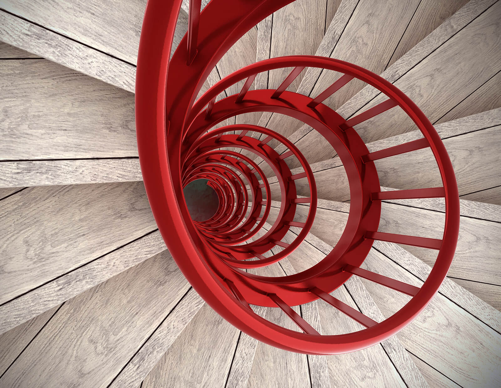 wooden staircase with red bannister